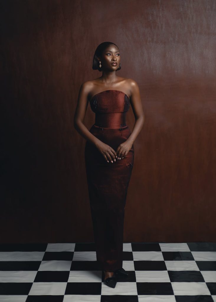 A stunning portrait of a woman in traditional Nigerian fashion, showcasing elegance and cultural style.